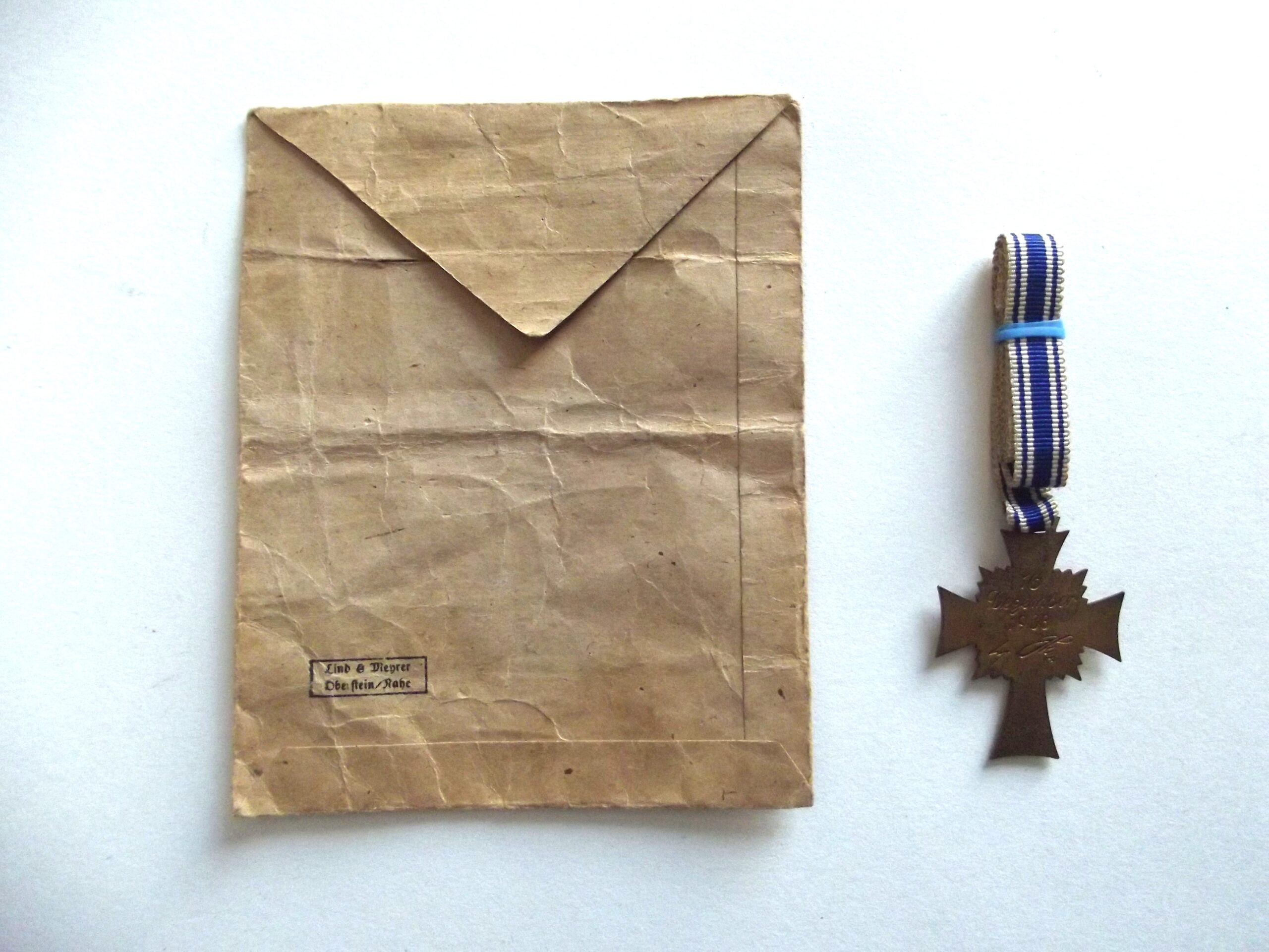 GERMAN BRONZE MOTHERS CROSS AWARD & PACKET LIND & MEYRER