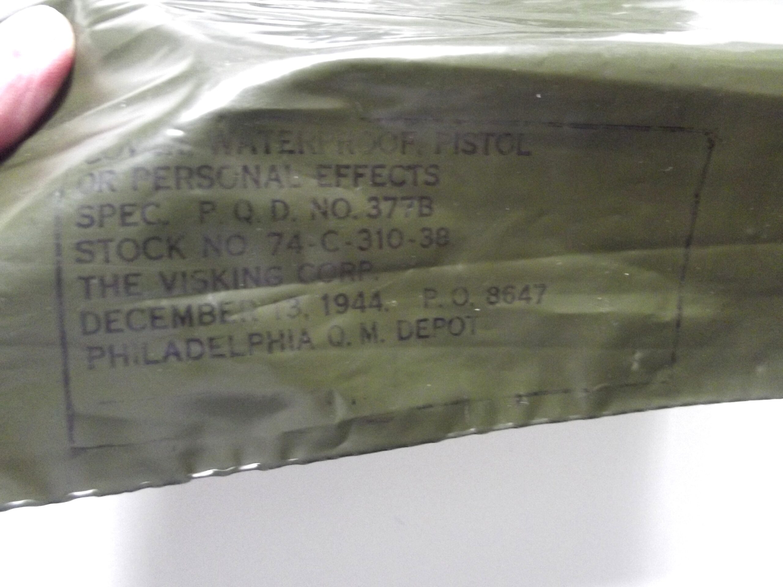 WW2 AMERICAN DISPOSABLE PERSONEL EFFECTS OR PISTOL COVER DATED 1944